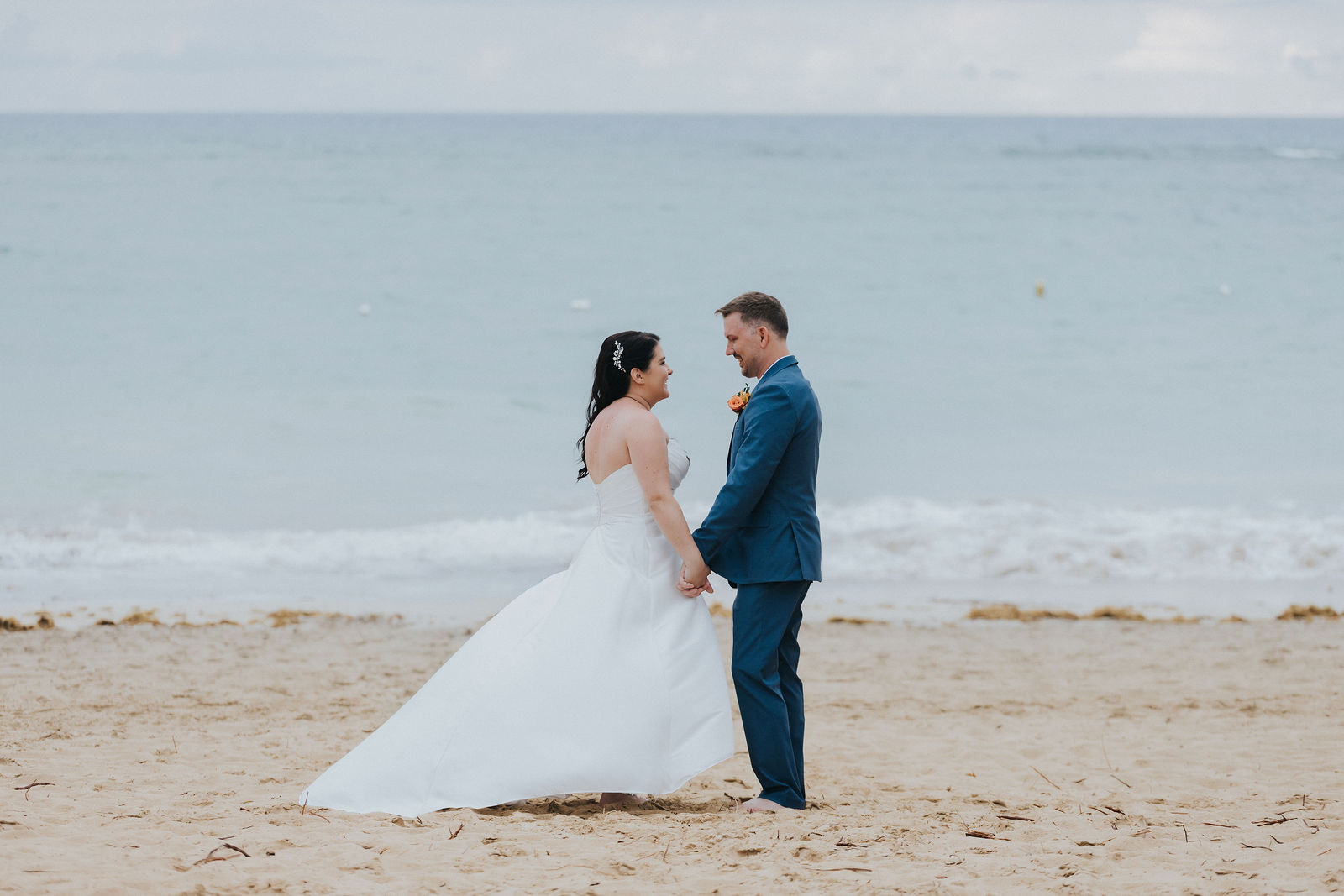 Bride and groom photographed wide on a Punta Cana beach