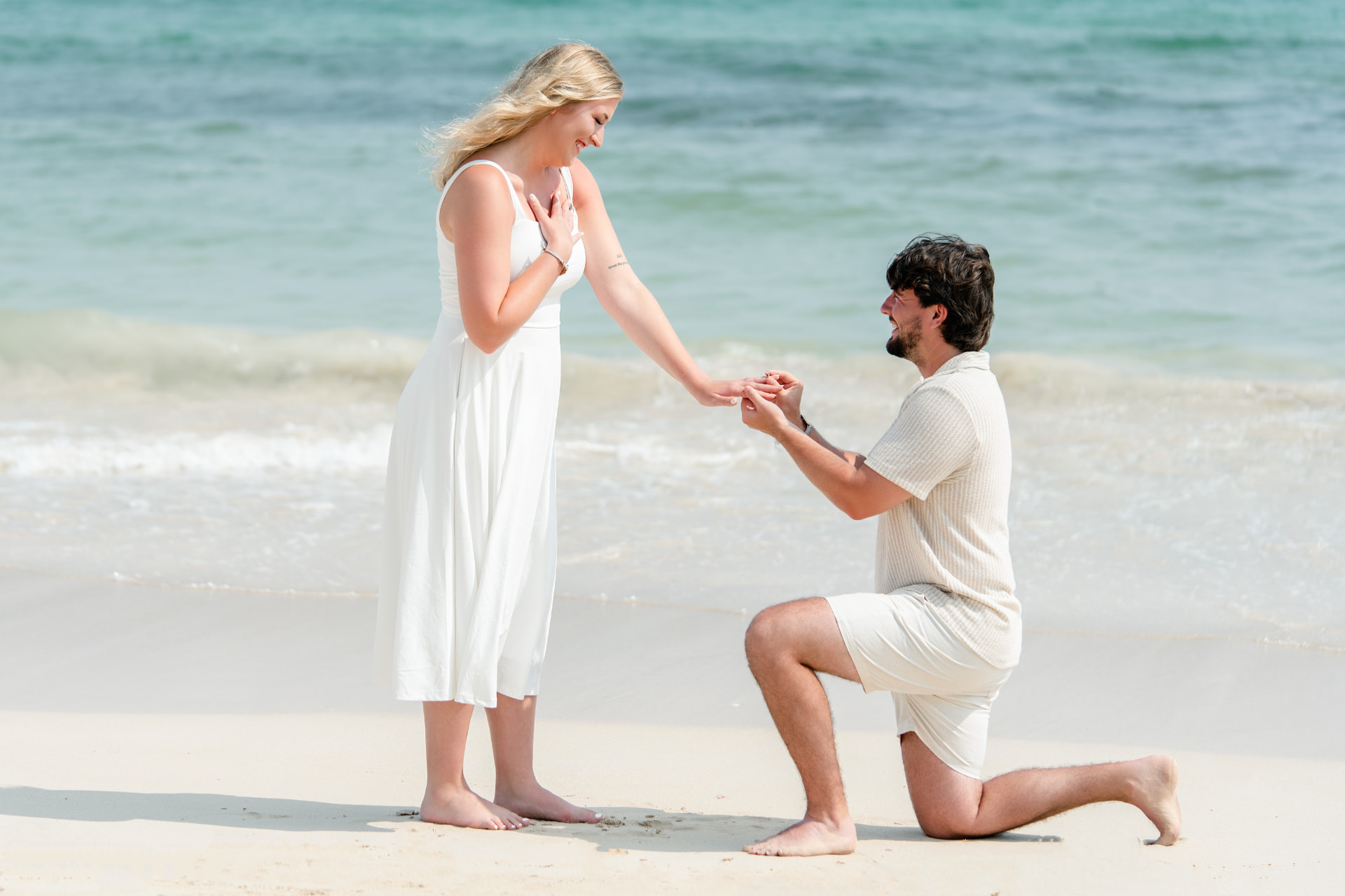 A surprise proposal on a Punta Cana beach — the moment a ring is placed